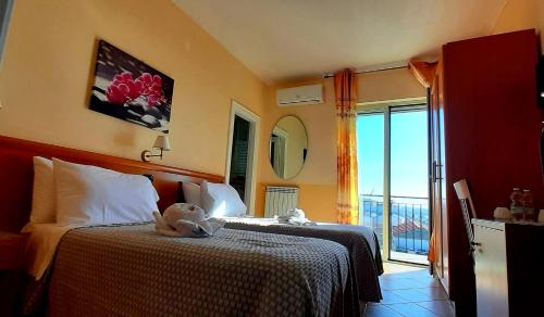 Postel nebo postele na pokoji v ubytování Villa Pacis