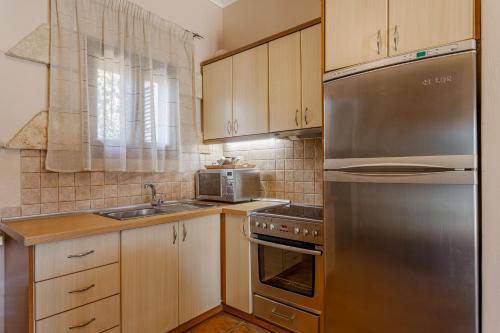 Dapur atau dapur kecil di Olympia Villas