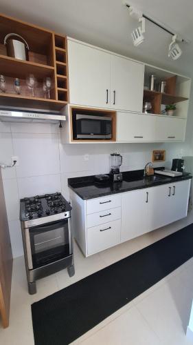 Cuisine ou kitchenette dans l'établissement Apartamento de descanso com a brisa do Mar!