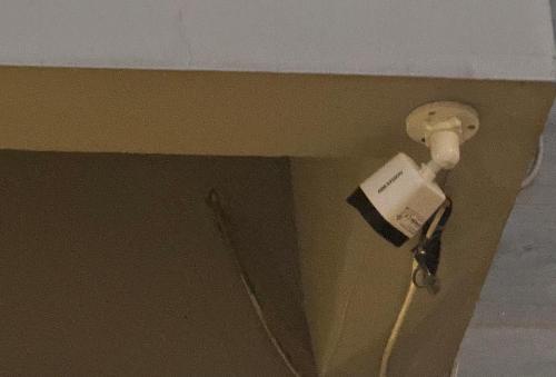 a cord plugged into an electrical outlet in a wall at Bridge Residency-2 Top City-1 Islamabad in Islamabad