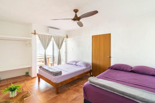 Ένα ή περισσότερα κρεβάτια σε δωμάτιο στο Casa para descansar y disfrutar la vida en el mar