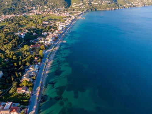 an aerial view of a beach next to the water at Aenaon Corfu Apartments #01 in Ýpsos