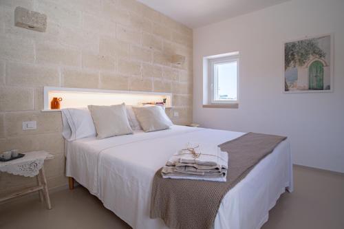 Ένα ή περισσότερα κρεβάτια σε δωμάτιο στο Heres - Trulli experience