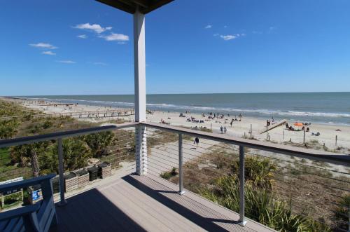 a view of the beach from the balcony of a beach house at Little Peace of Heaven in Folly Beach
