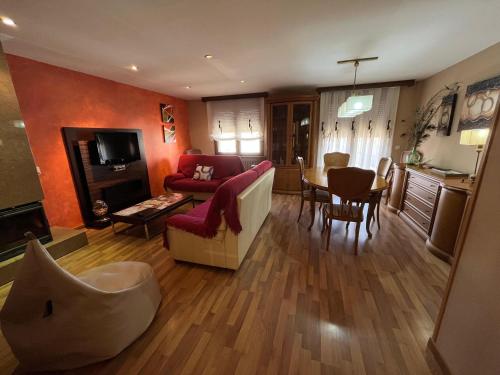 a living room with a couch and a table at Casa La Parra en Teruel in Villastar