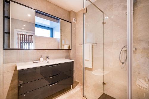 a bathroom with a sink and a shower at Old Town Charm Apartment in Albufeira