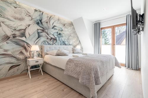 Posteľ alebo postele v izbe v ubytovaní Gąsienica Apartamenty Queen