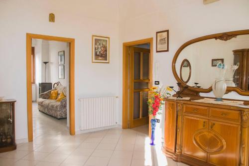 a bathroom with a sink and a mirror in a room at Casa la Torre - YourPlace Abruzzo in Rocca San Giovanni