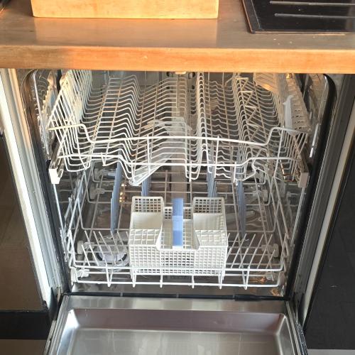 a dishwasher filled with lots of dishes at Panoramic Sunset Terrace Attic in Rome