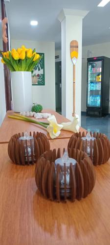 three pieces of chocolate on top of a wooden table at Pousada Tropical Maragogi in Maragogi