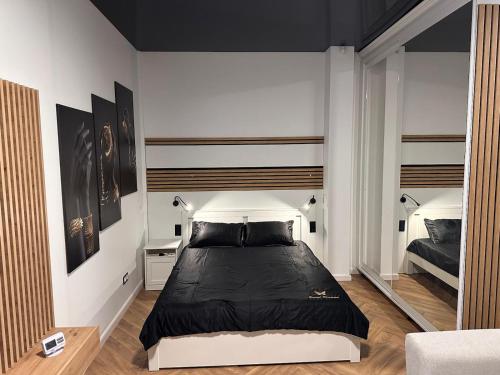 Ένα ή περισσότερα κρεβάτια σε δωμάτιο στο Top Central Residence