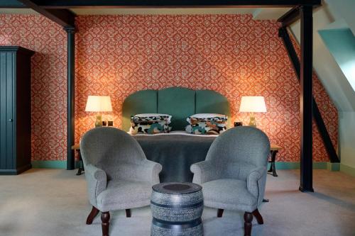 a room with two chairs and a table with two lamps at Hotel du Vin Bristol in Bristol