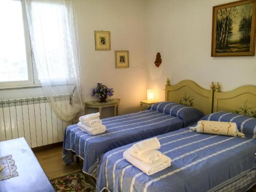 Giường trong phòng chung tại Tuscany Roses