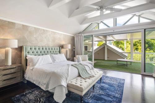 a bedroom with a bed and a large window at Zen Villa in Key West