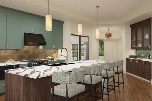 a kitchen with a large island with chairs in it at Hilton Vacation Club Mill Springs Lodge Pigeon Forge in Pigeon Forge