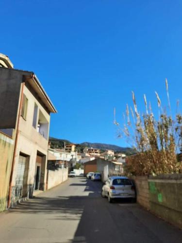 a car parked on a street next to a building at Domu Asquer 5 in Fluminimaggiore