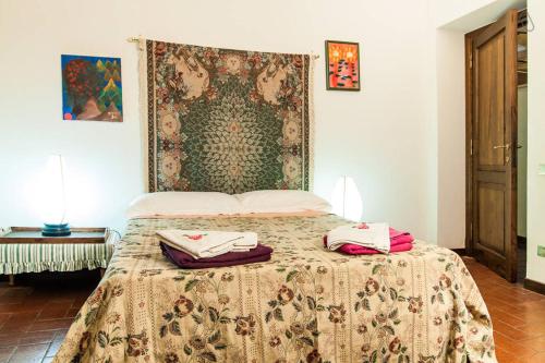 a bedroom with a bed with two pillows on it at Il Casale in Formia