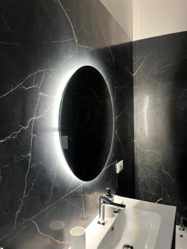 a bathroom with a sink and a mirror on the wall at Sweet dreams in Palermo