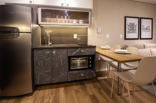 Dapur atau dapur kecil di Loft 612 Canto com garagem