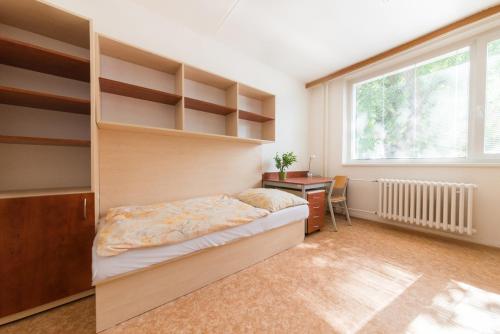 Postel nebo postele na pokoji v ubytování Pod Palackého vrchem - GProoms
