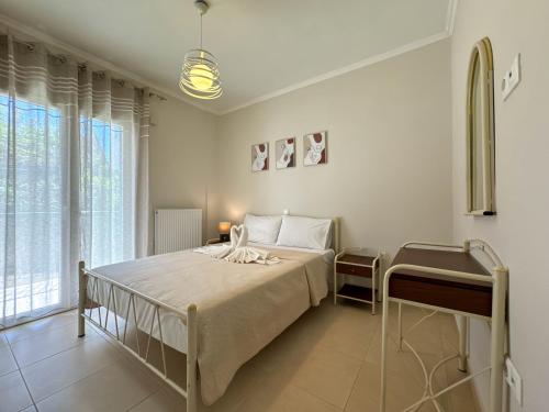 Ένα ή περισσότερα κρεβάτια σε δωμάτιο στο Naselia Apartments