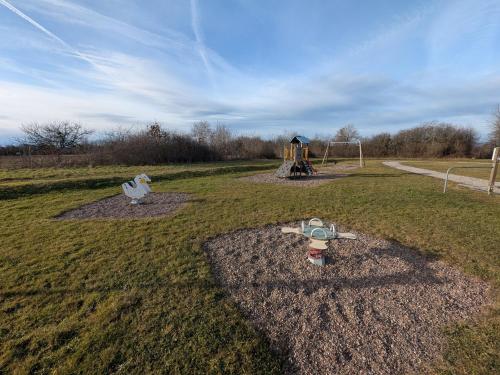 a park with a playground with a play equipment at Gîte familial avec terrasse et espace enfants à Faymont - FR-1-583-370 in Faymont