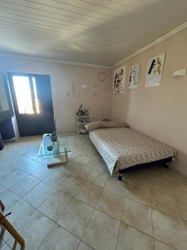 Postel nebo postele na pokoji v ubytování Appartamento Tropheum