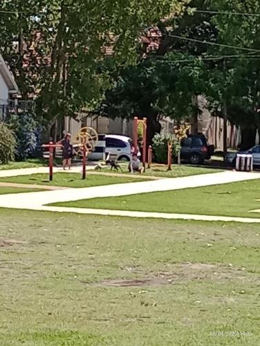 a park with a playground with a giraffe at house city in Mar del Plata