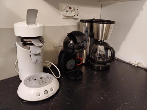 a counter top with a coffee maker and a blender at Les Gîtes de Juliane et Eric in Gedinne
