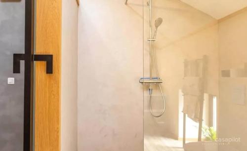 a shower in a bathroom with a glass door at House with Jacuzzi in Gouvy / 80 m² in Wattermal