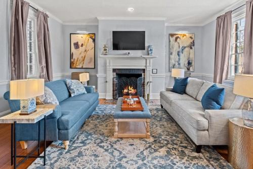 a living room with a couch and a fireplace at The Piedmont in Alexandria