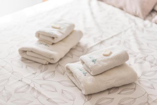 En eller flere senge i et værelse på Hotel Atero