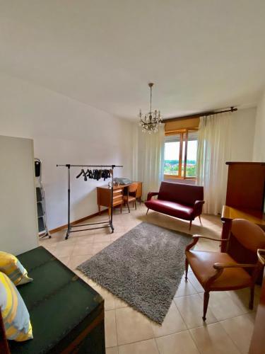 a living room with a couch and a table at Casa Flora in Ivrea