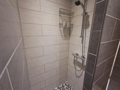 een badkamer met een douche met een glazen deur bij My Quiet Place near Carcassonne in Carcassonne