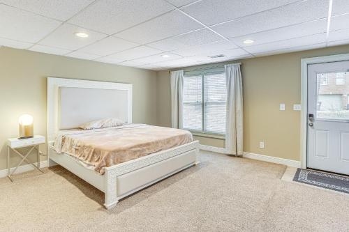 a large bedroom with a bed and a window at Home Theater and Yard Family Retreat in Bessemer in Bessemer