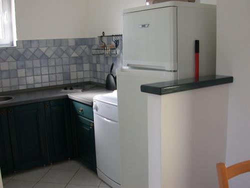 Kuchyň nebo kuchyňský kout v ubytování Vis a Vis Apartments