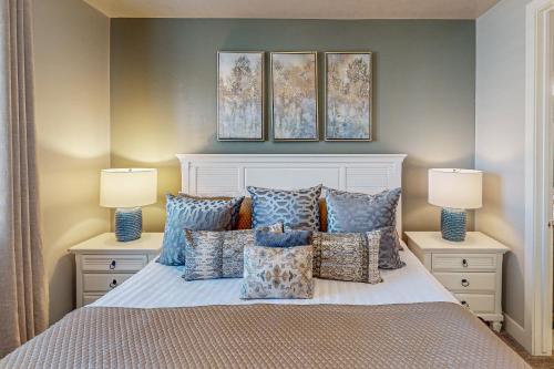 a bedroom with a bed with pillows and two lamps at Red Mountain Paradise: Paradise Village #90 in Santa Clara