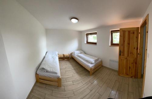 Postel nebo postele na pokoji v ubytování Chata Gejza