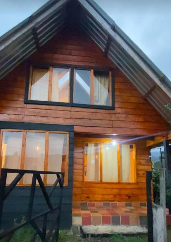 a house with windows on the side of it at Cabaña el bucanero in Pasto