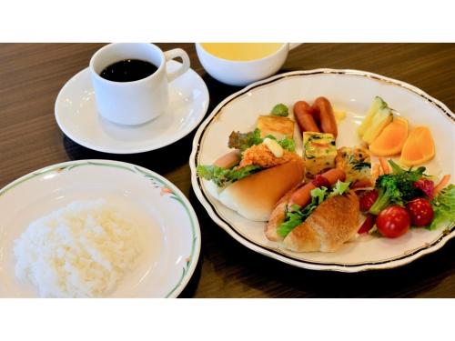 a table with two plates of food and a cup of coffee at COCOLAND - Vacation STAY 74019v in Ube
