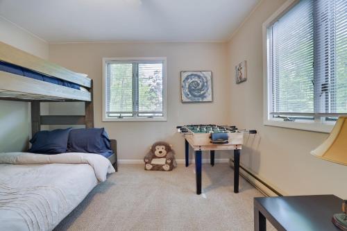 a bedroom with a bed and a desk in it at Dreamy Lake House - Fireplace, Firepit & Pet Friendly in Pocono Lake