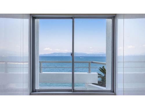 a window with a view of the ocean at Ibusuki Kaijo Hotel - Vacation STAY 87379v in Ibusuki