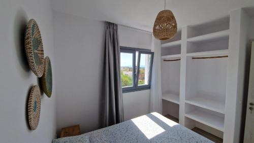 Ένα ή περισσότερα κρεβάτια σε δωμάτιο στο Apartment Filotimo
