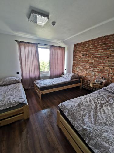 Postel nebo postele na pokoji v ubytování Stalowy Gościniec