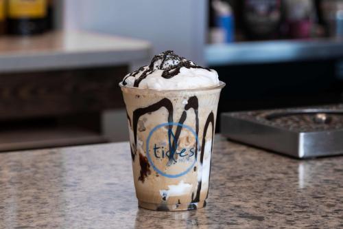 a chocolate milkshake in a cup on a counter at Best Western Premier - The Tides in Orange Beach
