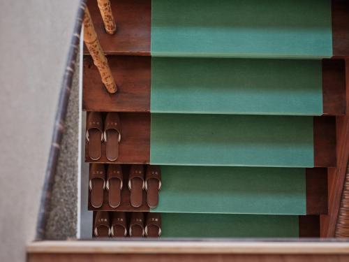 a wooden book shelf with shoes on it at Mikasakan - Vacation STAY 17863 in Kinokawa