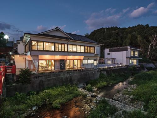 a large house with a lot of windows at Mikasakan - Vacation STAY 17873 in Kinokawa