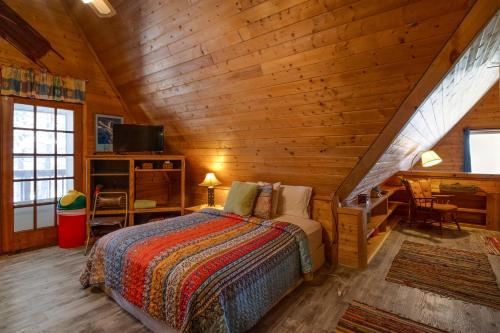 a bedroom with a bed in a wooden cabin at Angel Fire Cabin in Angel Fire