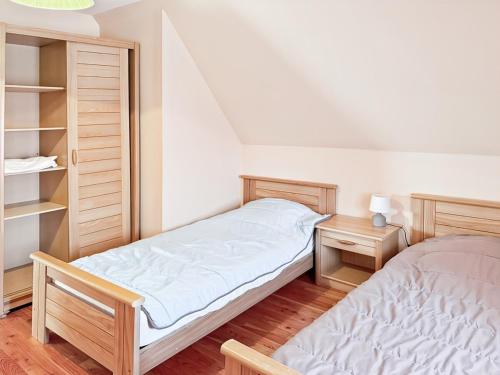 Katil atau katil-katil dalam bilik di Gîte Mourniac cœur village - Corrèze - 3ch - 6pers