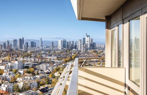 a balcony with a view of the city at Leonardo Royal Hotel Frankfurt in Frankfurt/Main